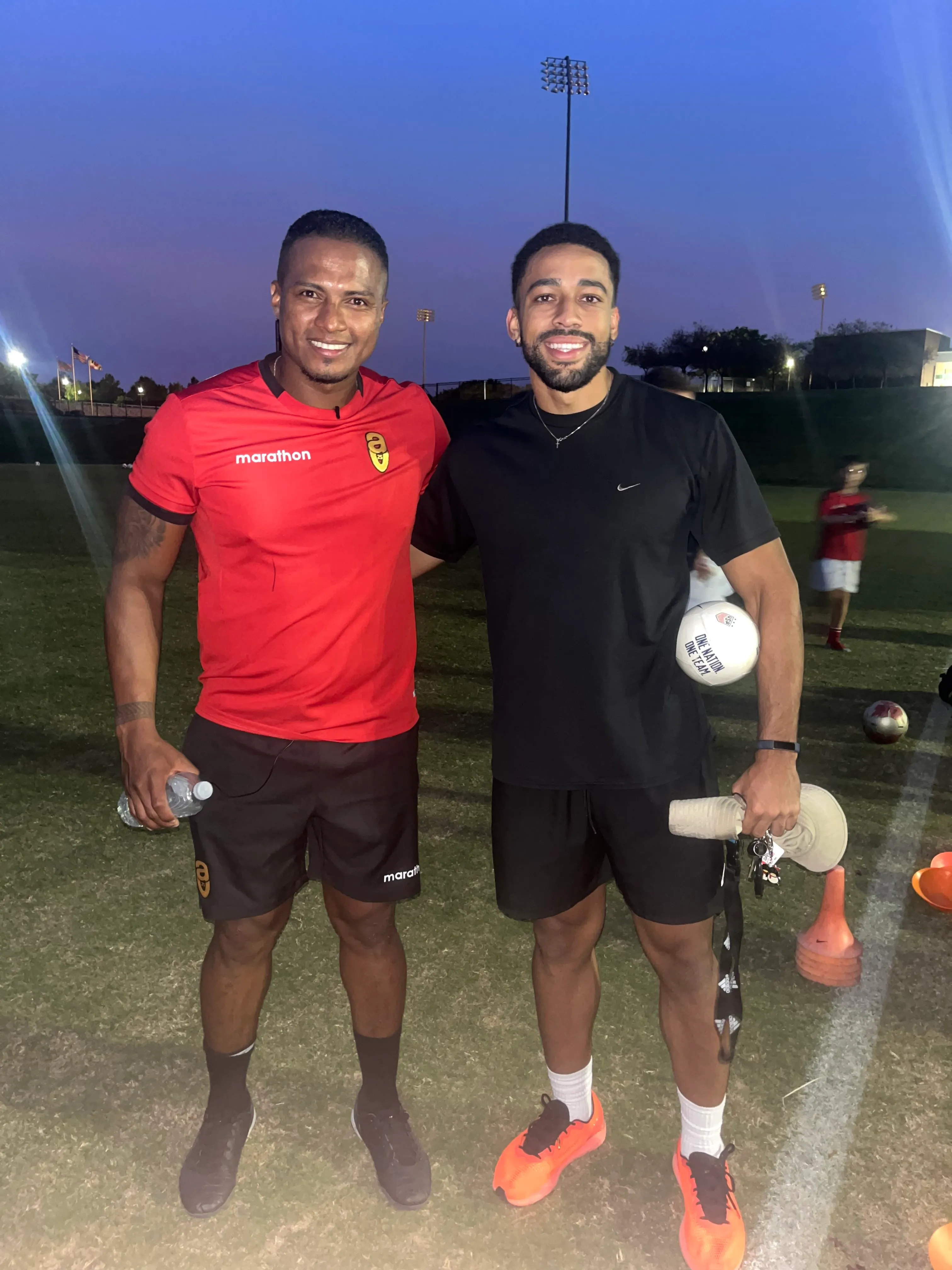 Jordan Gamarra with a fellow coach at a soccer training session