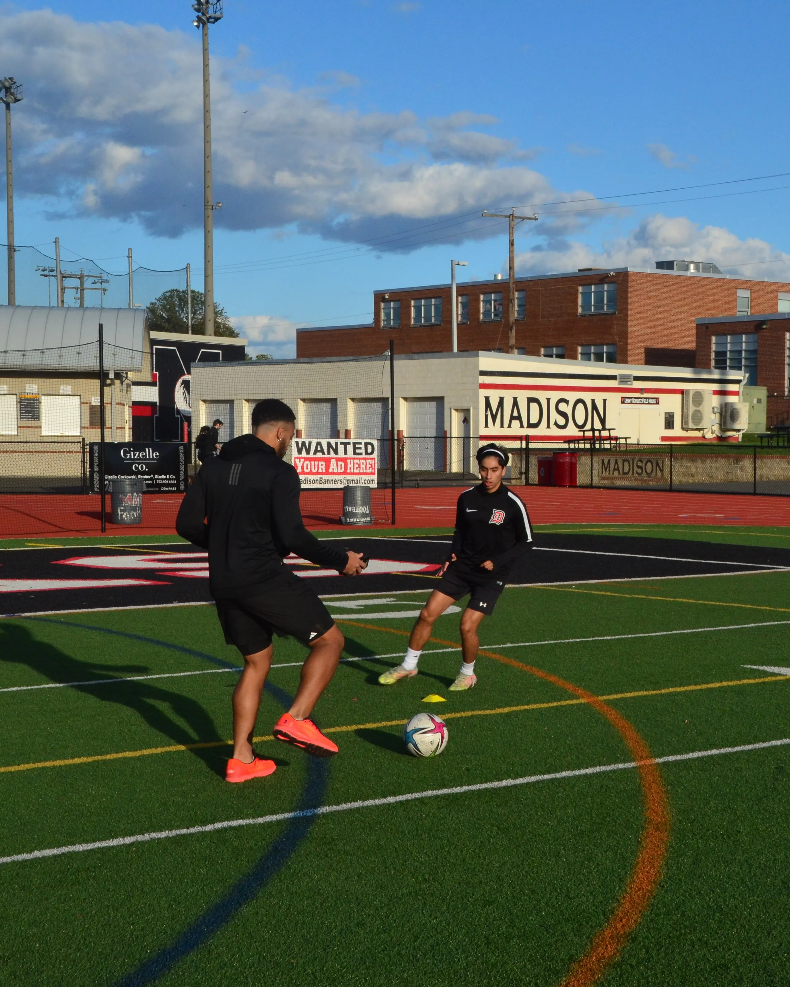Jordan Gamarra coaching athletes on the field